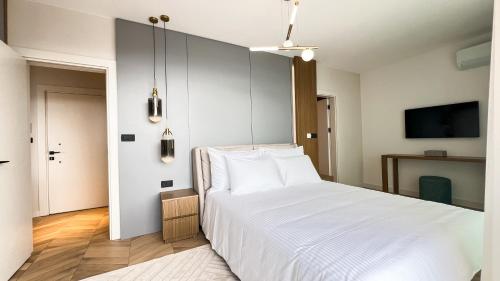 Ένα ή περισσότερα κρεβάτια σε δωμάτιο στο Apart hotel Emiia