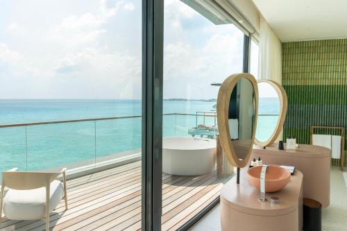 a bathroom with a view of the ocean at SO/ Maldives in South Male Atoll