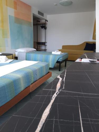 Cama o camas de una habitación en Hotel Alisei