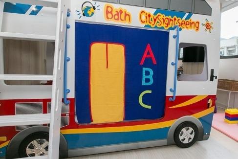 a toy fire truck parked next to a bunk bed at Meng Yun Ge Hotel in Jiaoxi