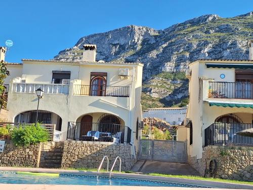 a house on the side of a mountain at La Karina in Denia
