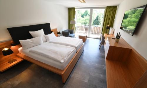 Postel nebo postele na pokoji v ubytování Hotel Fuxxbau