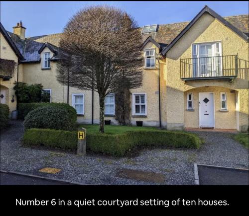 a house with a tree in front of it at Beautiful home in Thomastown in Thomastown