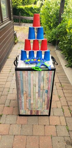 a table with red and blue party hats on it at Chalet 176, Durbuy PROMO in Durbuy
