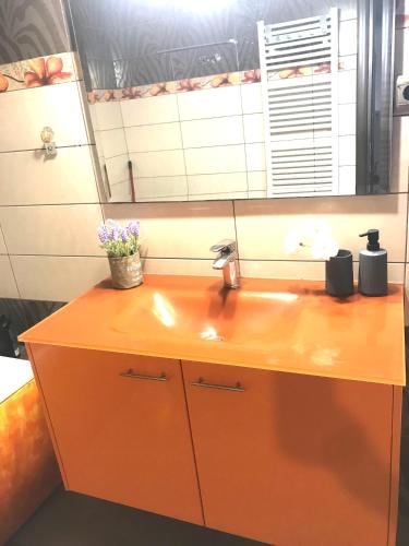 a bathroom counter with a sink and a window at Rias house in Néa Péramos
