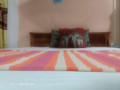 Un ou plusieurs lits dans un hébergement de l'établissement sigiriya village home stay
