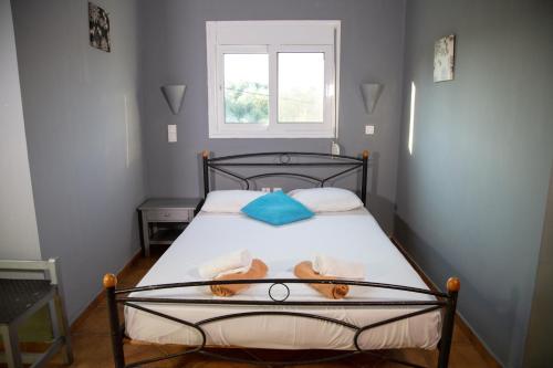 a bedroom with a bed with two teddy bears on it at Villa Preveza Apartments in Preveza