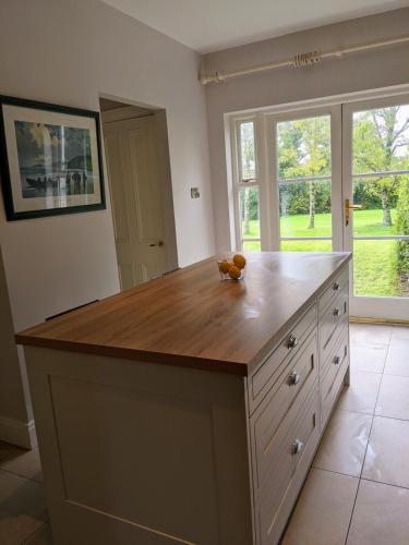 a large kitchen with a large wooden counter top at Beautiful home in Thomastown in Thomastown