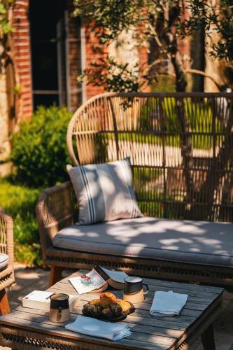 a bench with a table with a tray of food on it at Bengodi Boutique Hotel in Eceabat