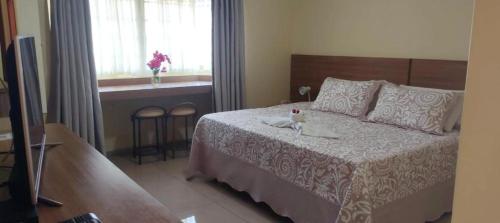 Ένα ή περισσότερα κρεβάτια σε δωμάτιο στο Vitoria Hotel