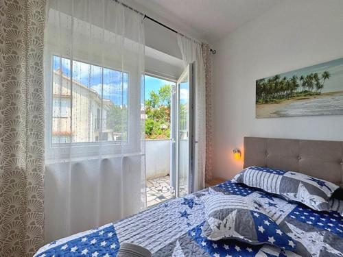 Postel nebo postele na pokoji v ubytování Apartments Nikolic