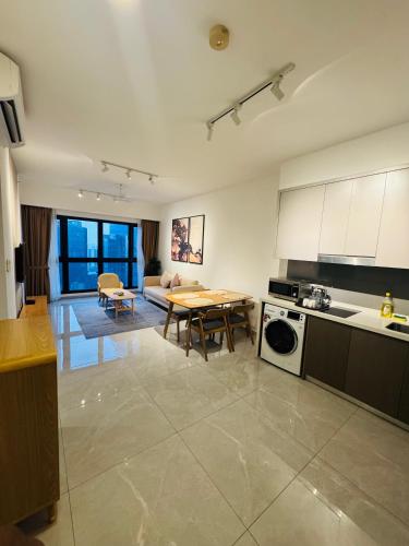 a large kitchen with a table and a dining room at Agile TRX Luxury suite Bukit bintang in Kuala Lumpur