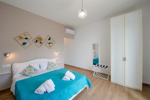 Postel nebo postele na pokoji v ubytování Malù B&B