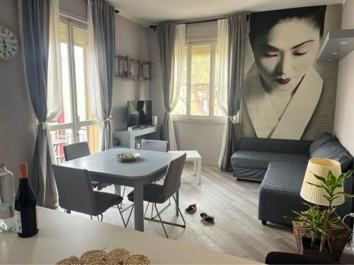 a living room with a couch and a table at Caesar's Apartments in Ravenna