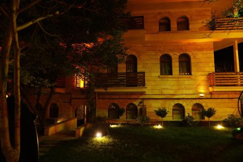a building with lights in front of it at night at Ayaz Stone House in Goreme