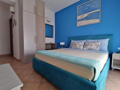 Postel nebo postele na pokoji v ubytování B&B Il Corallo