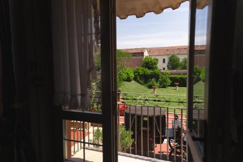 a view of a yard from a window at Hotel & SPA Duchessa Isabella Collection by GSA Hotels in Ferrara