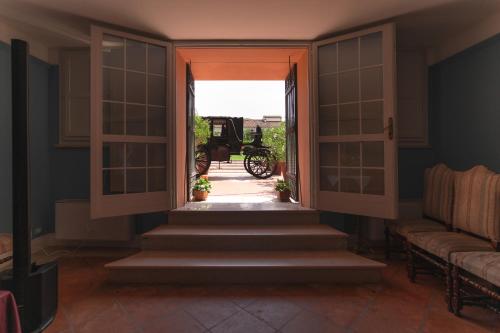 an entrance to a house with a motorcycle in the doorway at Hotel & SPA Duchessa Isabella Collection by GSA Hotels in Ferrara