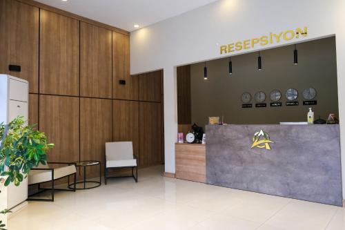a lobby with a reception desk in a building at Altayhan Otel in Amasya