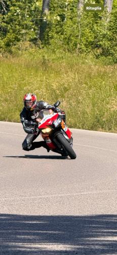 a person riding a motorcycle on the road at La corte dei celti -1 in San Benedetto Del Querceto