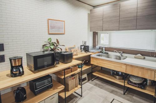 TV a/nebo společenská místnost v ubytování AKIYATO DATE DREAM DATE home