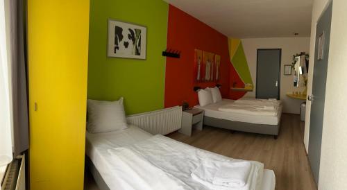 Un ou plusieurs lits dans un hébergement de l'établissement Hotel Gaudi