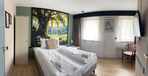 Un ou plusieurs lits dans un hébergement de l'établissement Hotel Gaudi