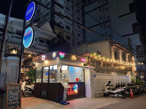 a food stand on a city street at night at Poolside Villa in Phnom Penh