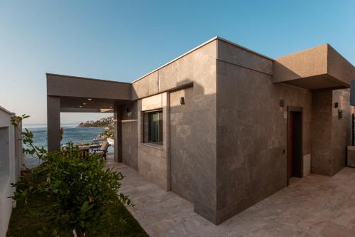 a house with a view of the ocean at Marje Villas Bodrum in Bodrum City