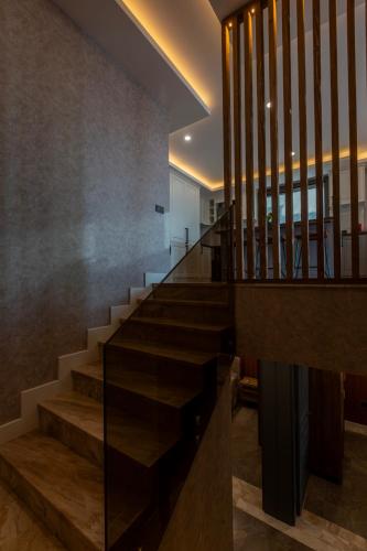a staircase in a house with a glass wall at Marje Villas Bodrum in Bodrum City