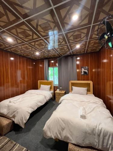 Postel nebo postele na pokoji v ubytování Mindok Guest House