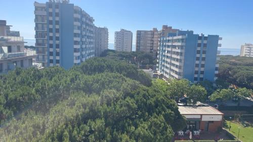 a hill in the middle of a city with tall buildings at Maravilloso apartamento Delux in Blanes
