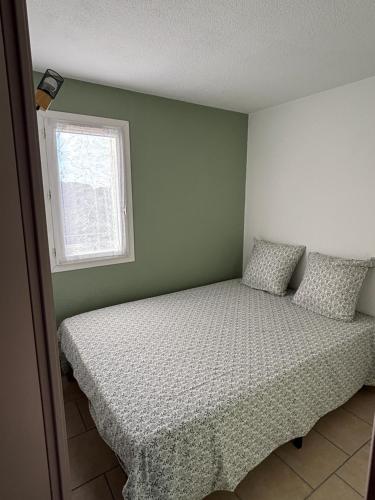 Katil atau katil-katil dalam bilik di Appartement Rio Camargue