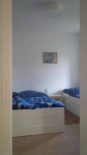a bedroom with a bed and a couch at Apartament u Zosi in Wisełka
