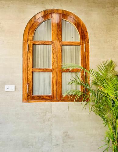 a wooden window on the side of a building at Shiv Sadan in Jaipur