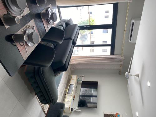 an overhead view of a living room with couches and a window at Aqua View in Bijilo