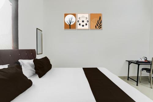 Ein Bett oder Betten in einem Zimmer der Unterkunft Hotel O Nice Inn
