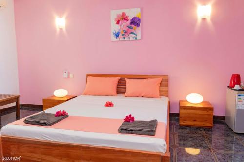 Postel nebo postele na pokoji v ubytování Hôtel Villa Les Orchidées