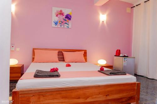 Postel nebo postele na pokoji v ubytování Hôtel Villa Les Orchidées
