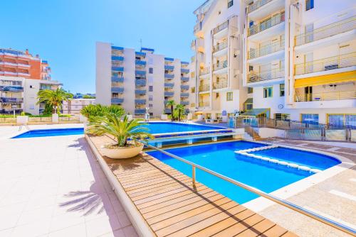a swimming pool in the middle of a building at Prime Location Penthouse with Stunning Sea Views in Salou