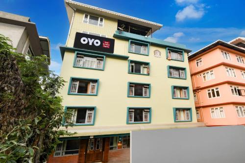 a building with the ovo sign on it at Hotel O De Sikkim Regency in Gangtok