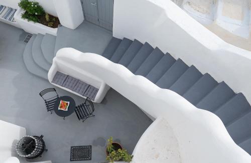 an overhead view of a staircase with a table and chairs at The Wine Nest in Megalokhori