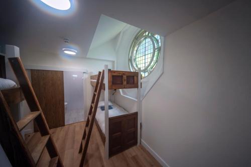 a small bathroom with a staircase and a window at St Michaels Lodge in Richmond