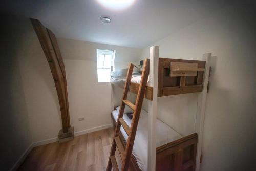 a room with two bunk beds in a room at St Michaels Lodge in Richmond