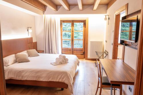 Postel nebo postele na pokoji v ubytování Hotel Rosa delle Alpi
