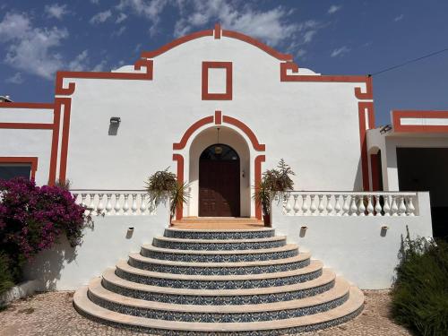 a group of stairs leading to a building at Villa Madeira in Silves