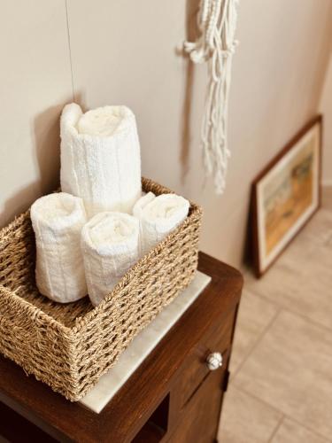 a basket filled with towels on top of a table at Dimora da Adele in Termoli
