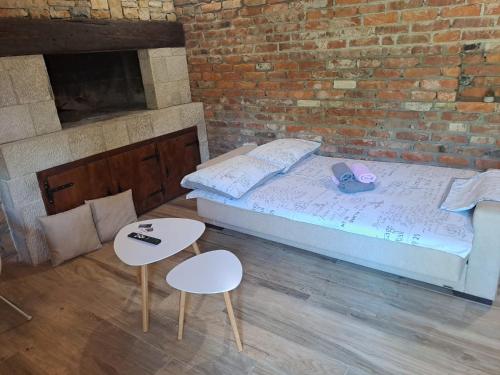 a bedroom with a bed and two tables at Konoba DB in Čapljina