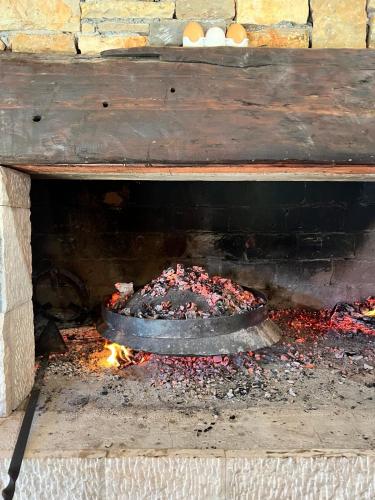 a fire pit with a pot on top of it at Konoba DB in Čapljina