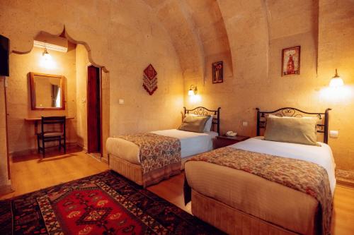 Katil atau katil-katil dalam bilik di Melis Cave Hotel